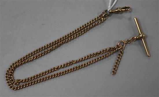 A 9ct gold watch chain with T-bar.